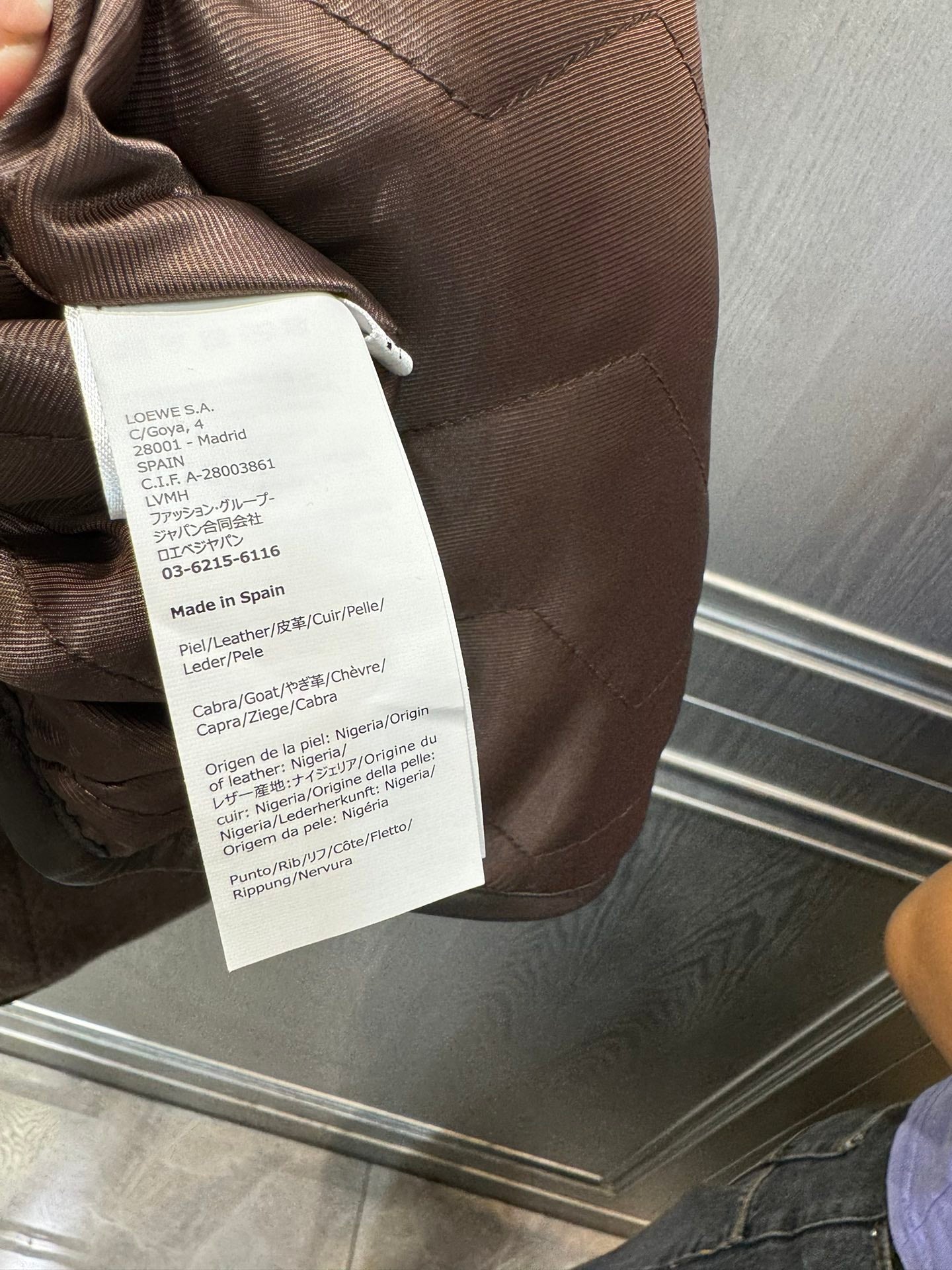 Her new alpaca wool hooded jacket