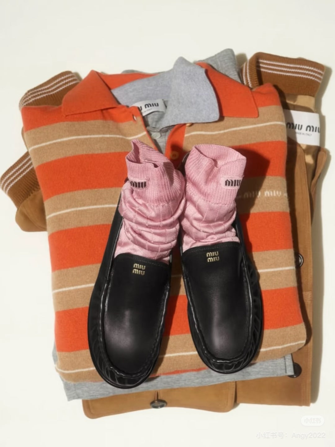 Mu 25fw Orange and brown knitted cashmere sweater