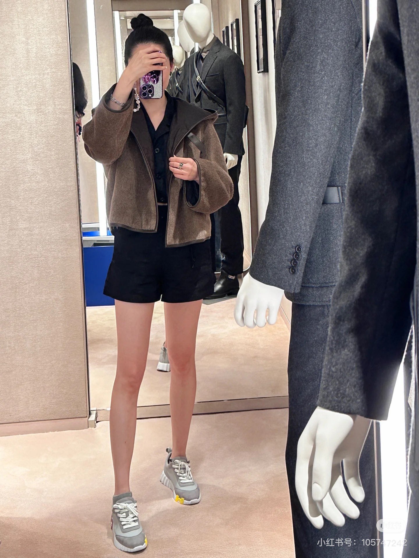 Her new alpaca wool hooded jacket