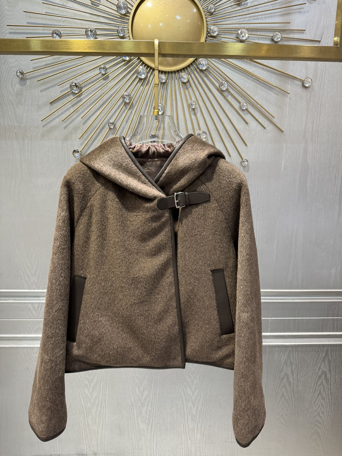 Her new alpaca wool hooded jacket