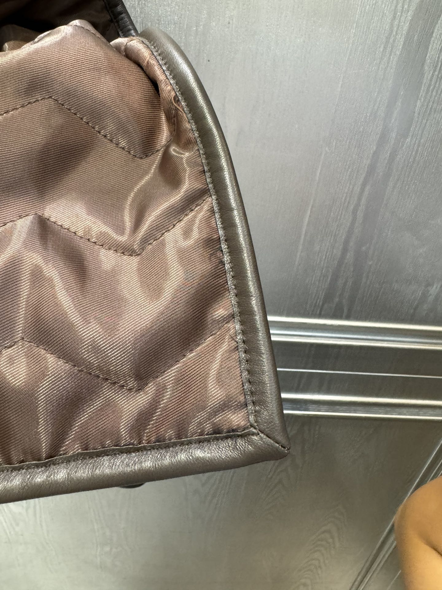 Her new alpaca wool hooded jacket