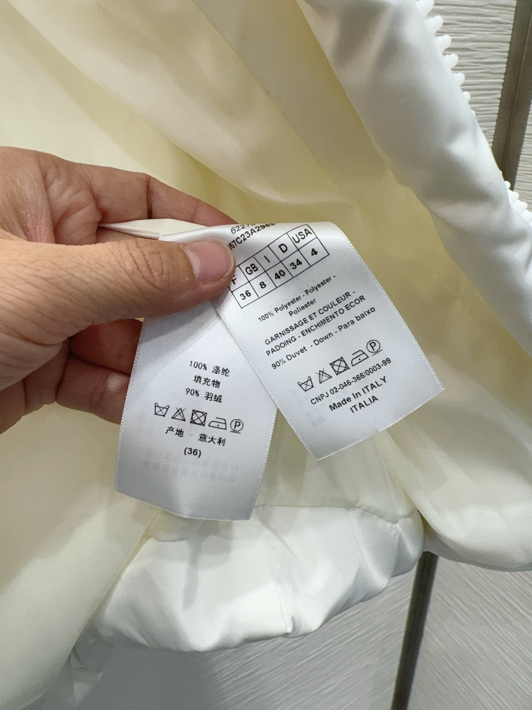 Cd 25fw down jacket with letter logo on the back